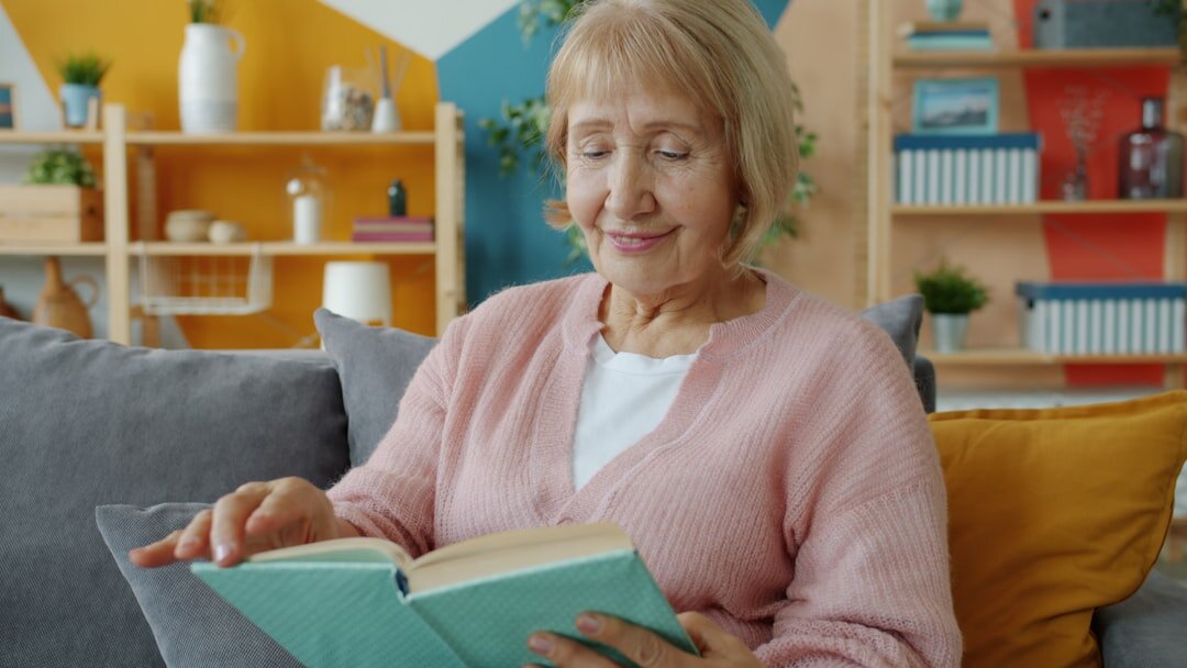 person reading book in quiet room