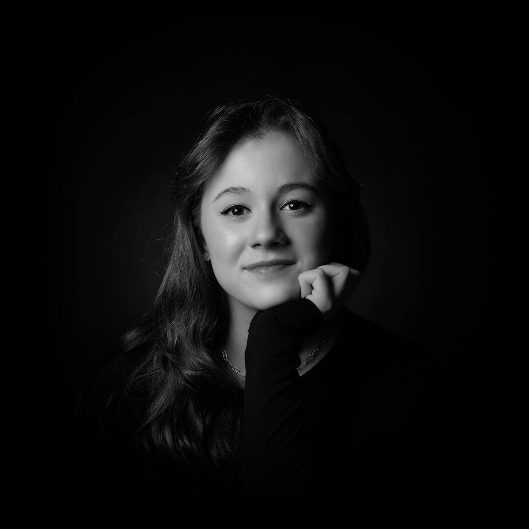 Brazilian woman with dark hair, professional headshot